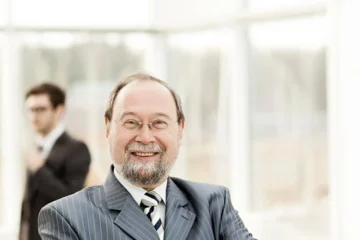 Portret radcy generalnego spółki w tle